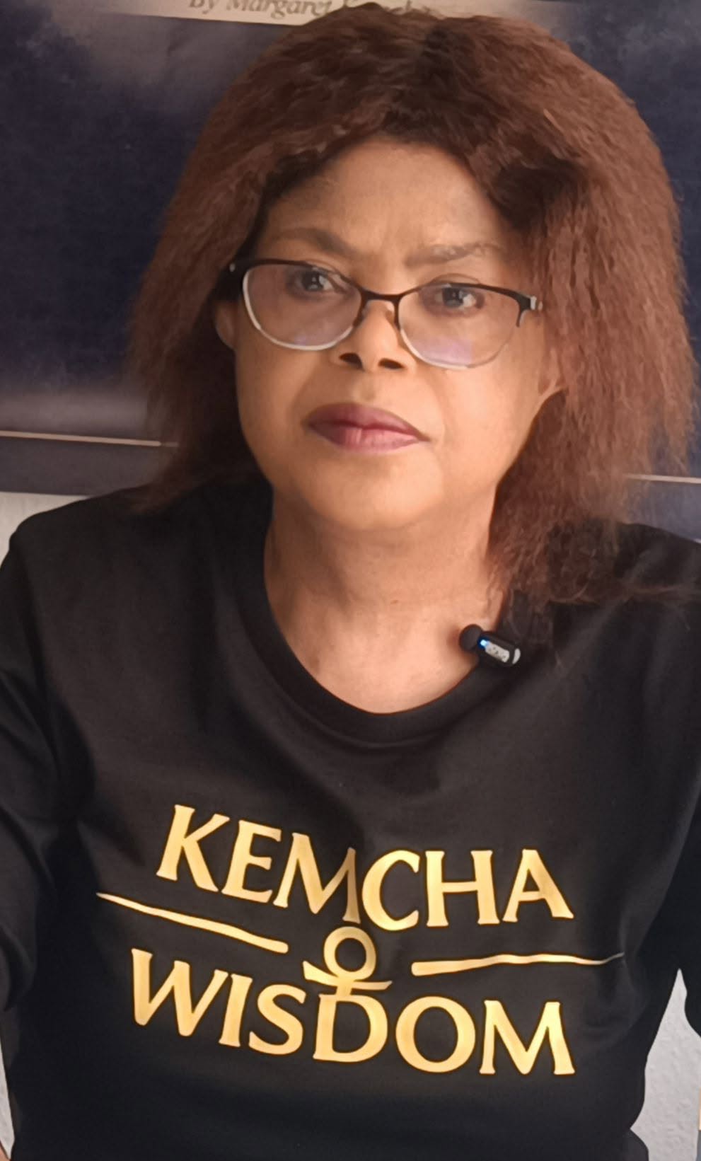 Margaret Kemcha wearing a Kemcha Wisdom shirt